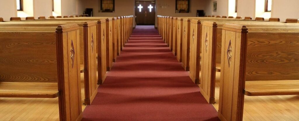Red carpeting on a church floor.