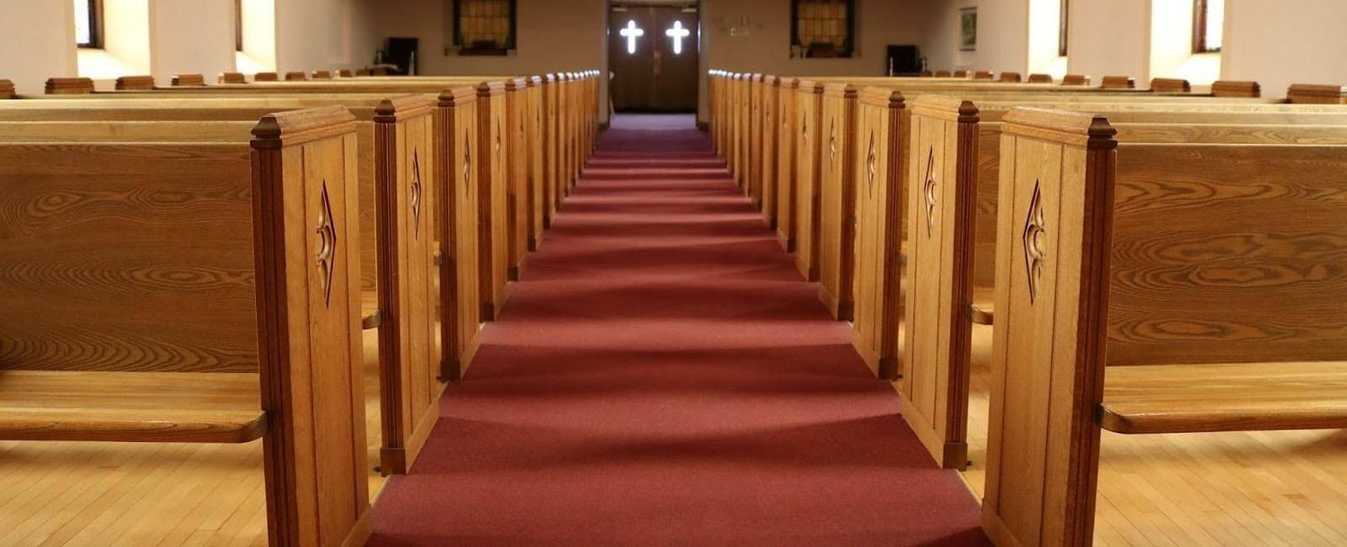 Red carpeting on a church floor.